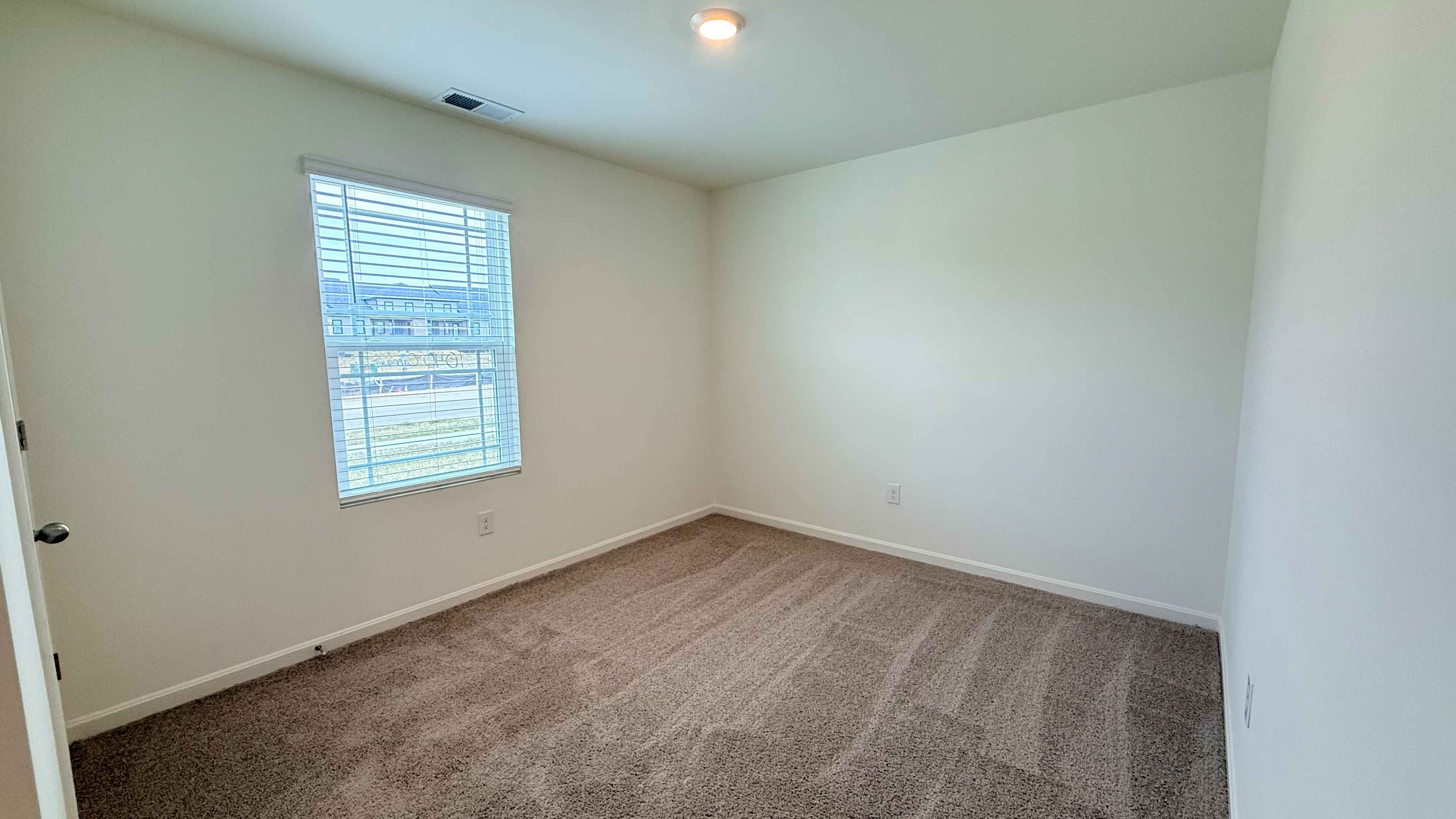 Spare bedroom #2 with single window.