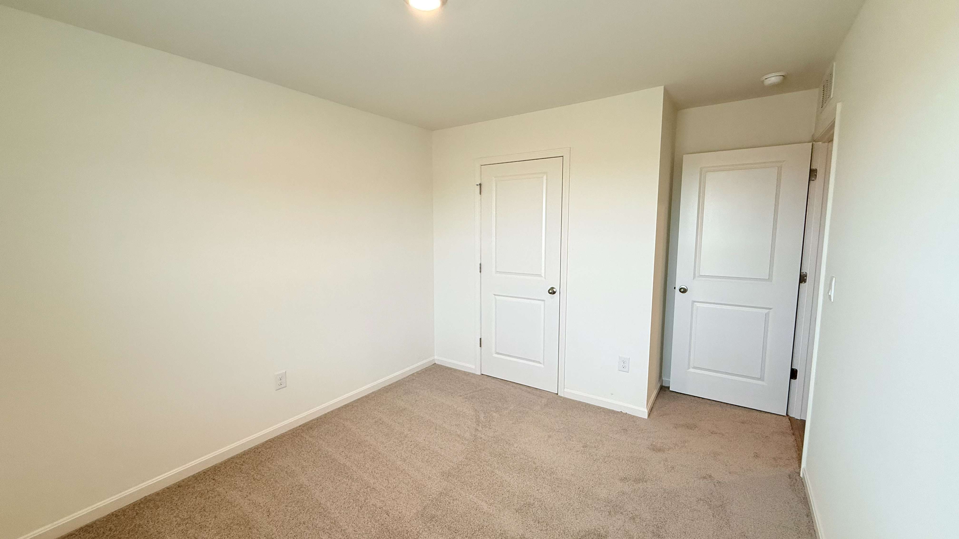 Other view of spare bedroom #3 and closet door.