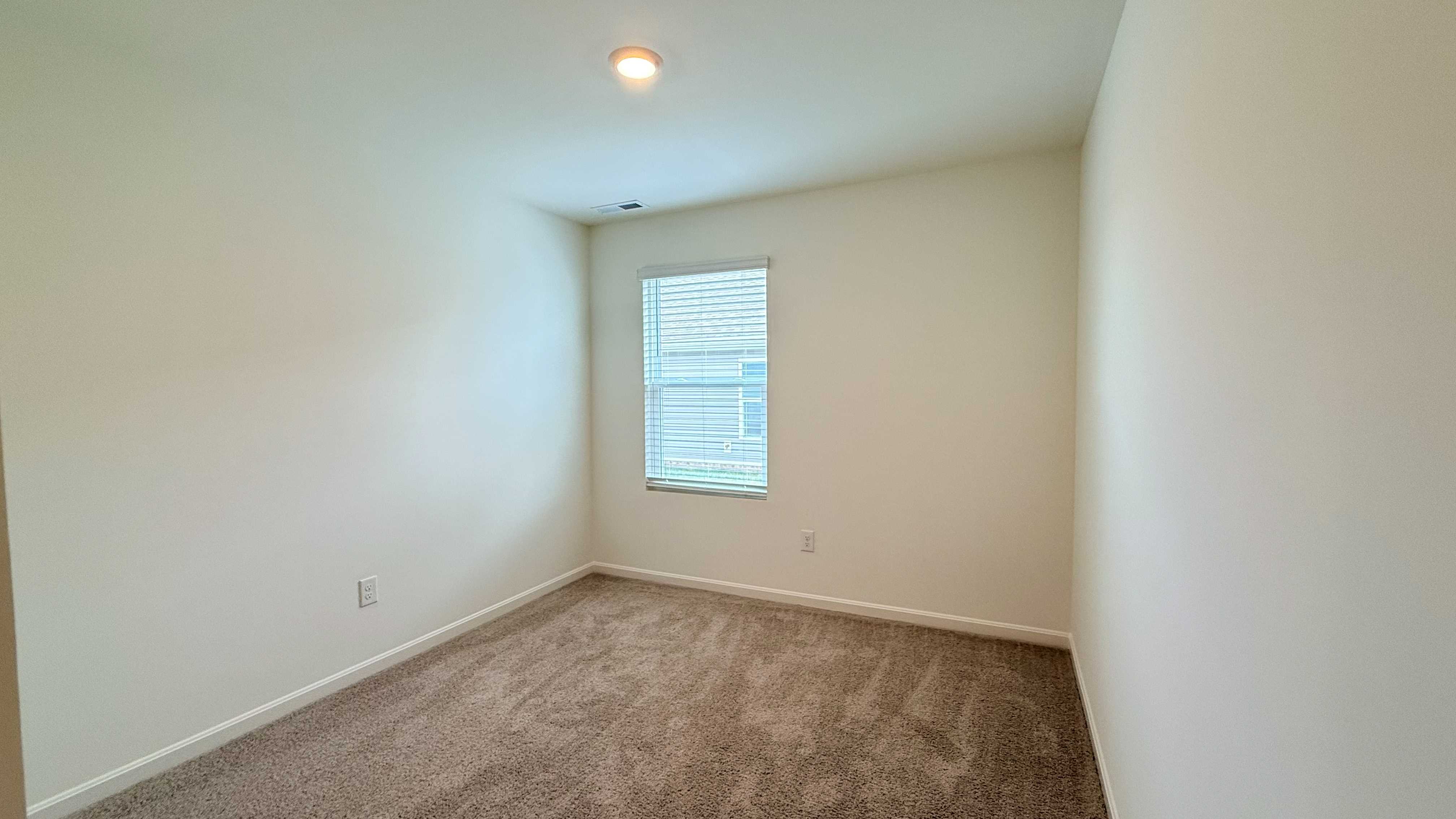 Spare bedroom #4 with single window.