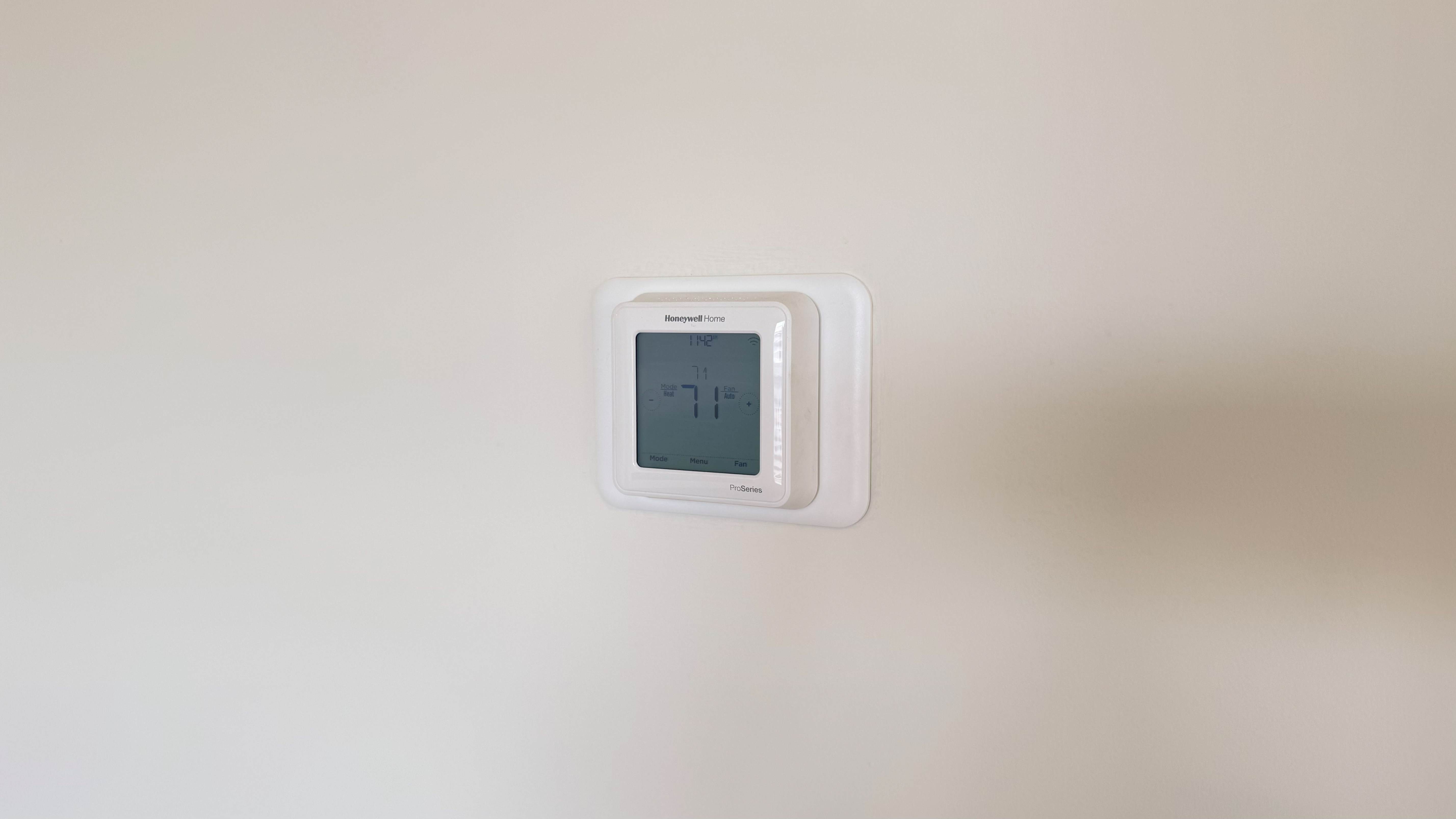 Digital thermostat on the wall.