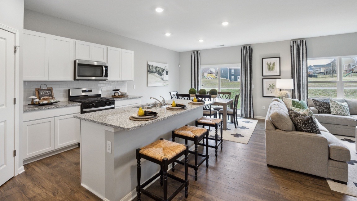 Open concept kitchen with granite countertops.