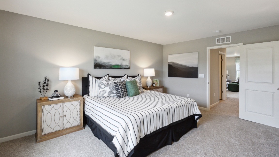 Bedroom with carpeted floors.