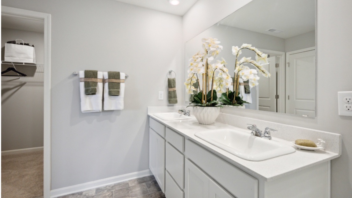 Primary bathroom with double vanity sink.