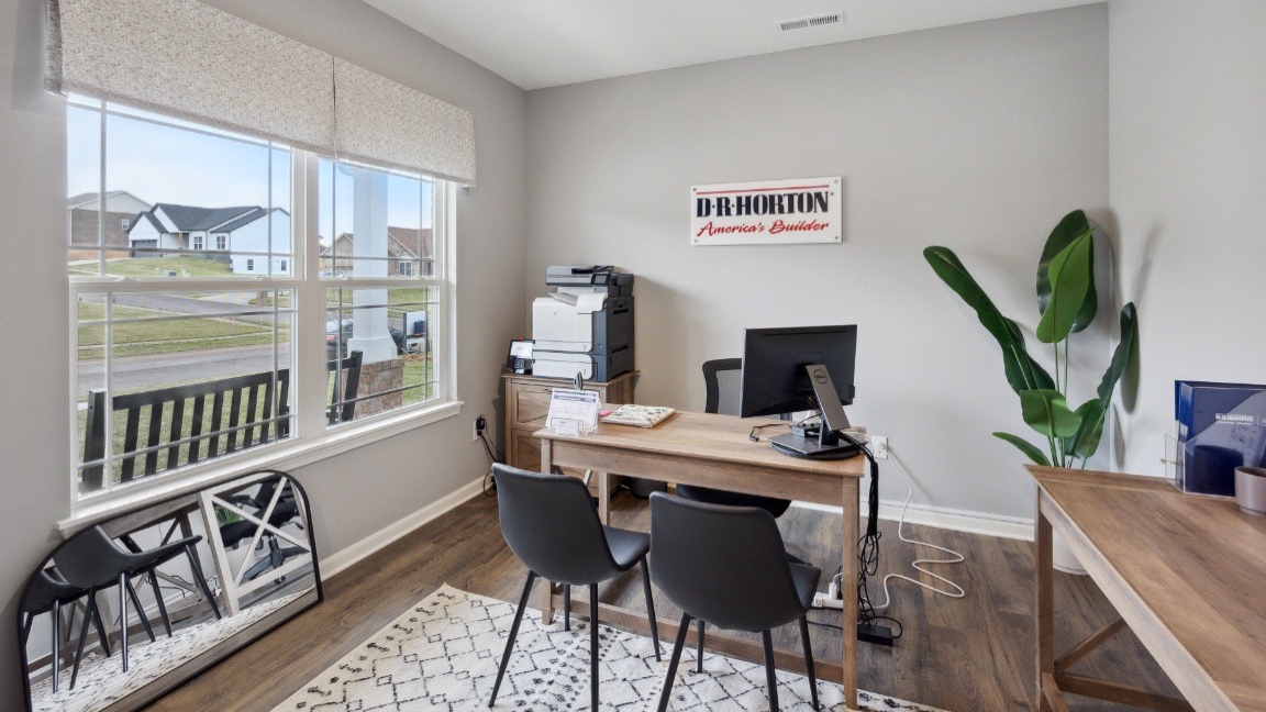 Front room with large window for natural lighting.