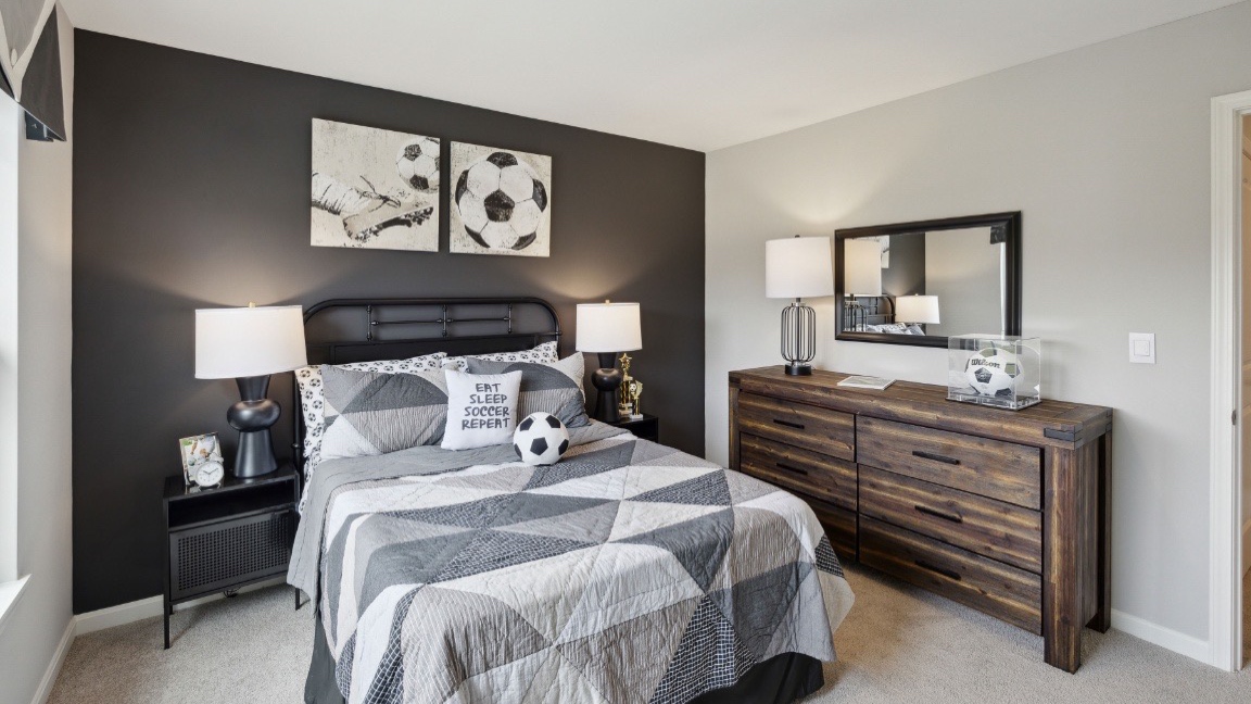 Bedroom with carpeted floors.