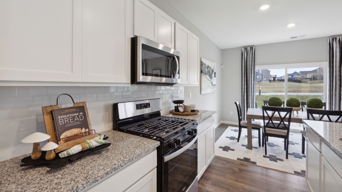Kitchen with gas stove and large kitchen island.