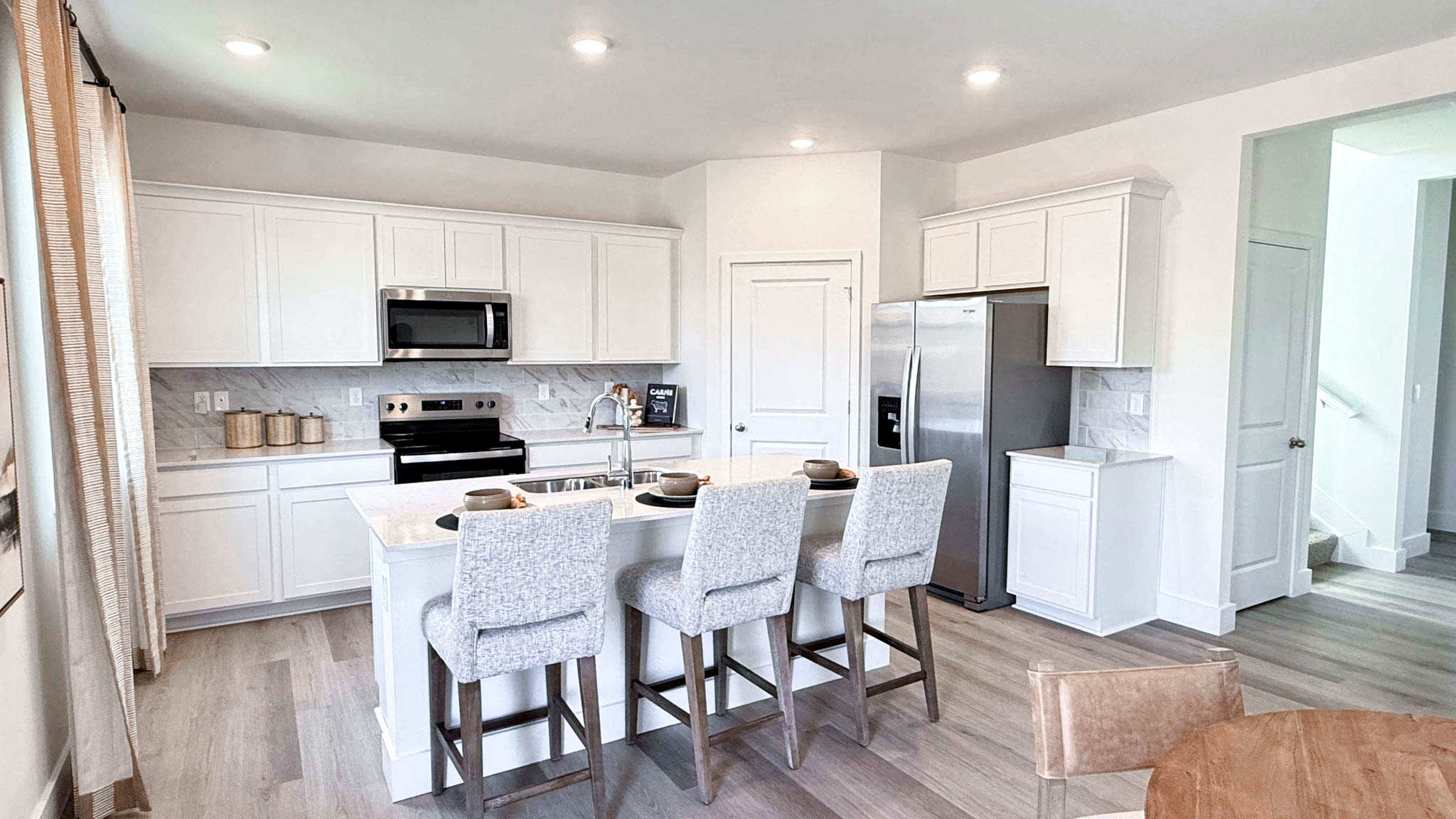 Kitchen island with three barstools