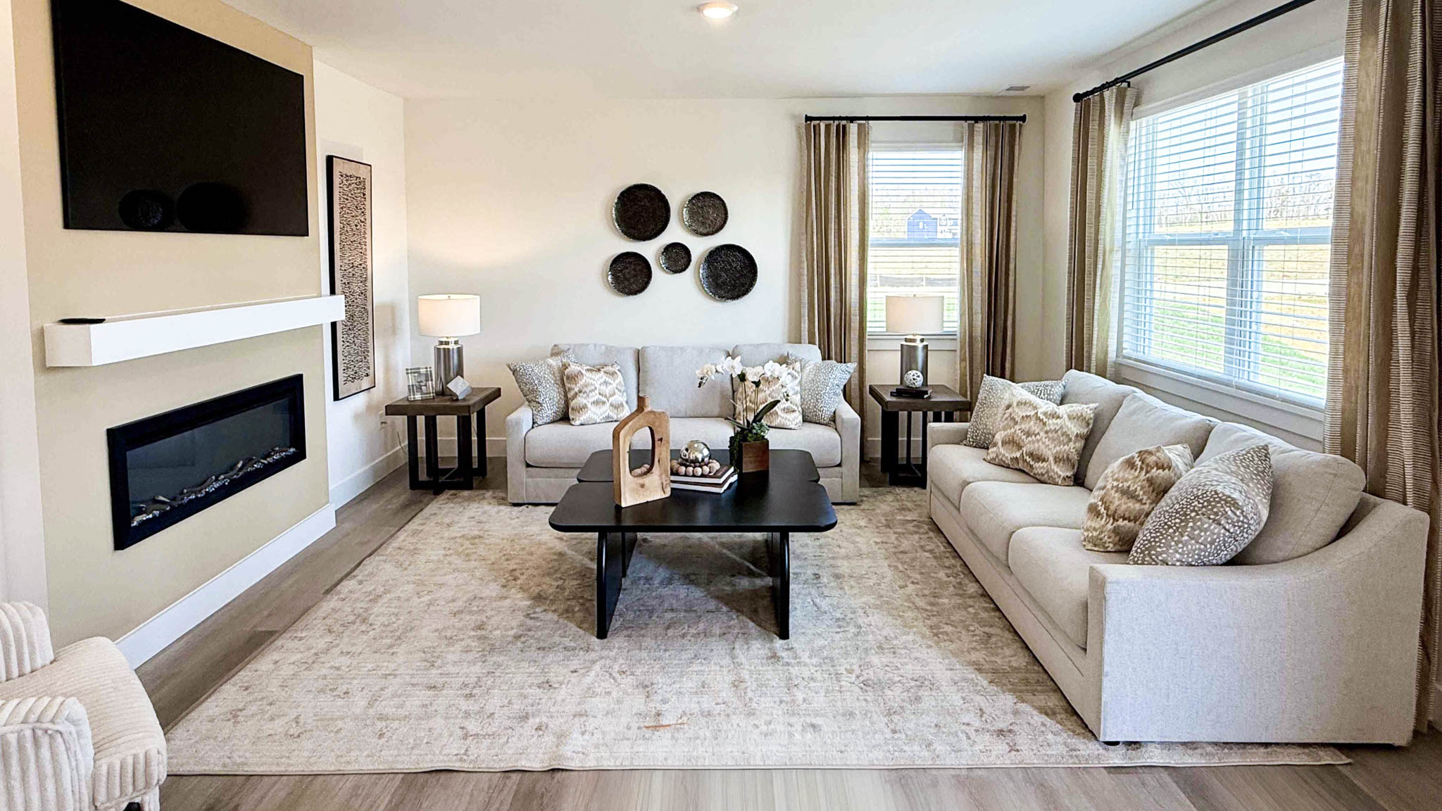 living room with wall mounted tv and electric fireplace
