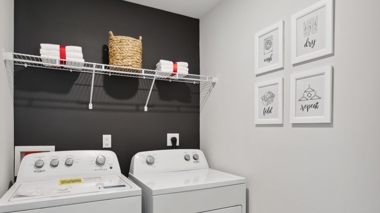 Wire shelving above washer and dryer in laundry room