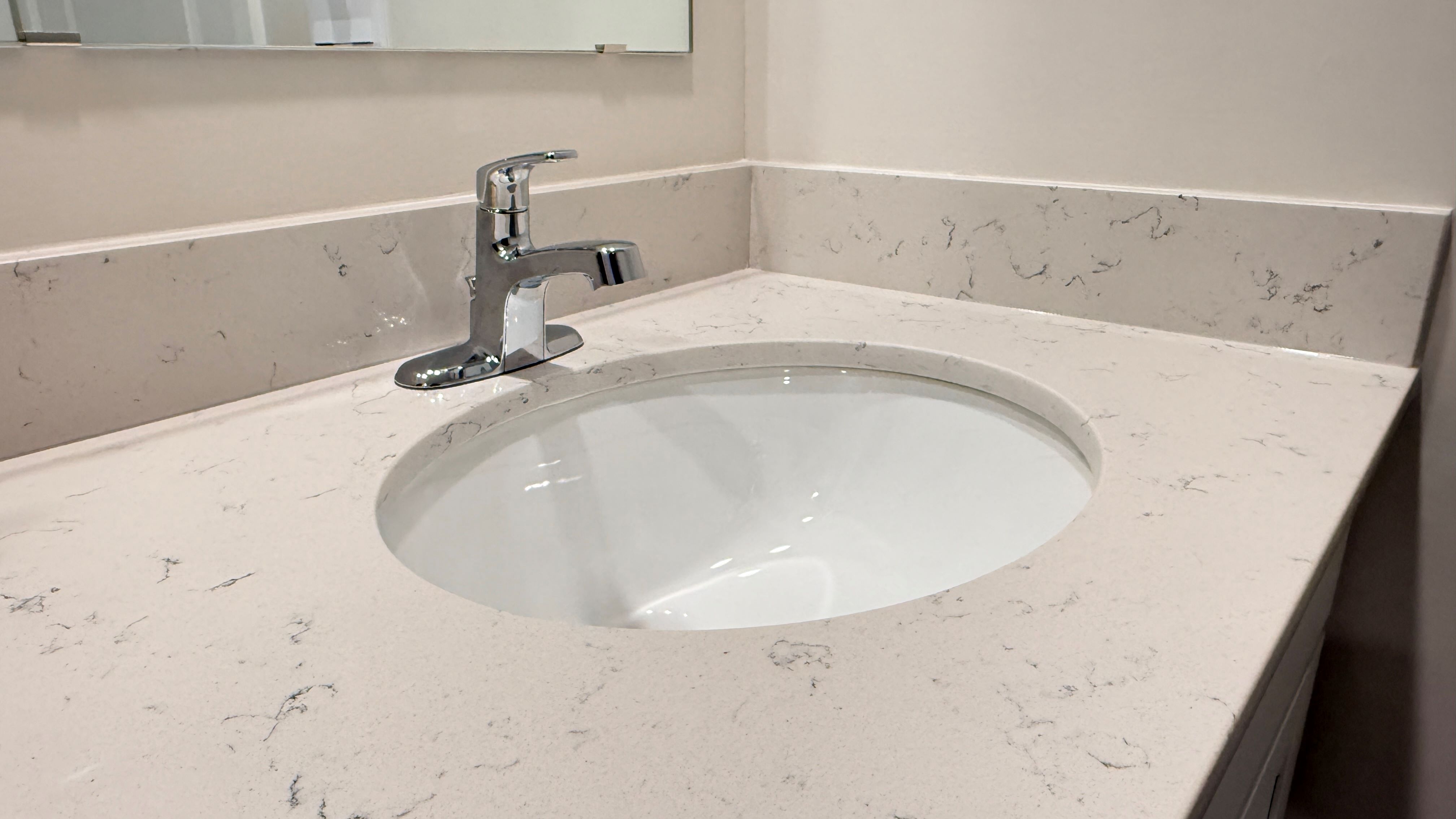 Primary bathroom sink with quartz countertop