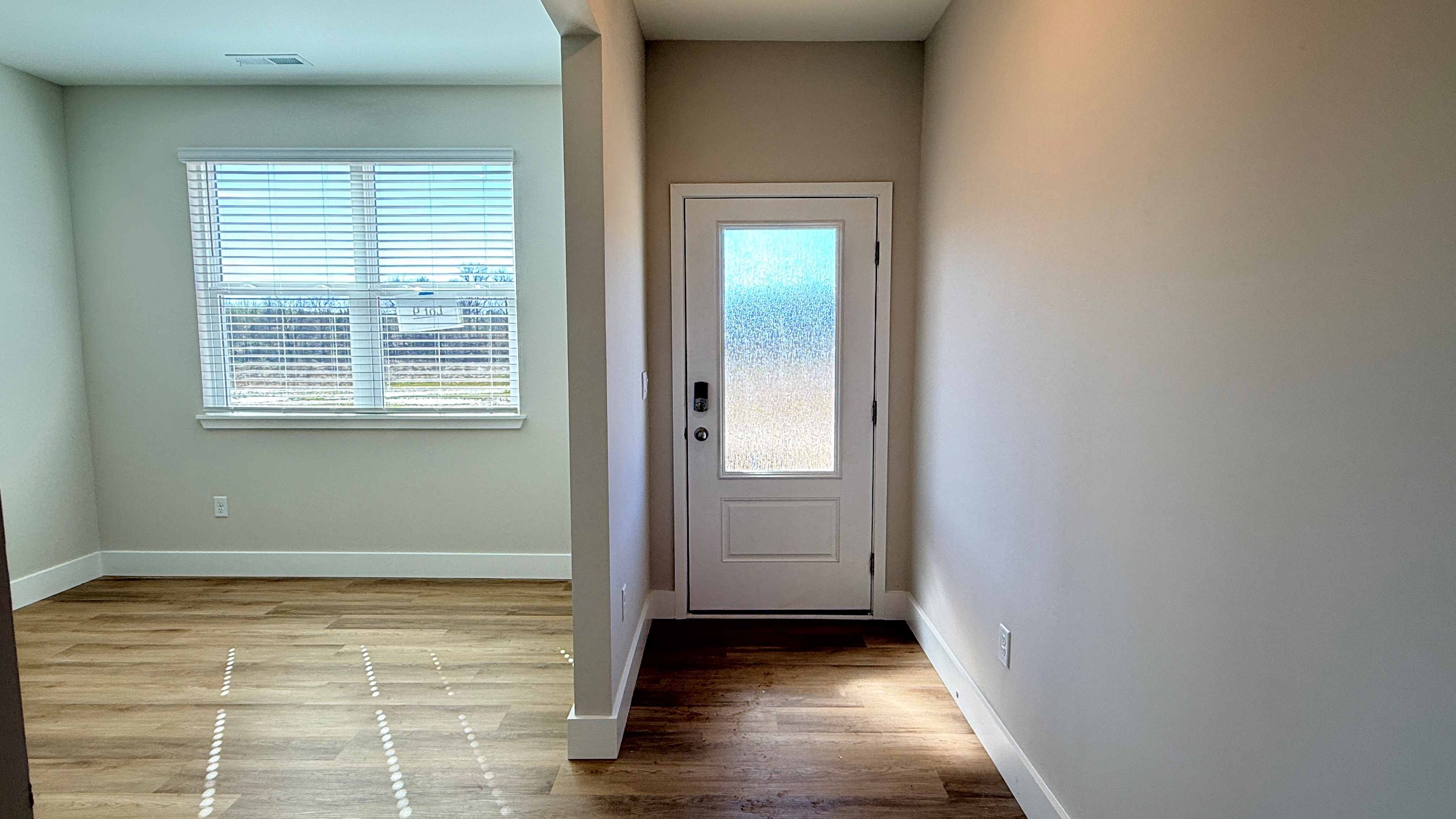 Foyer and first floor flex room to the left.