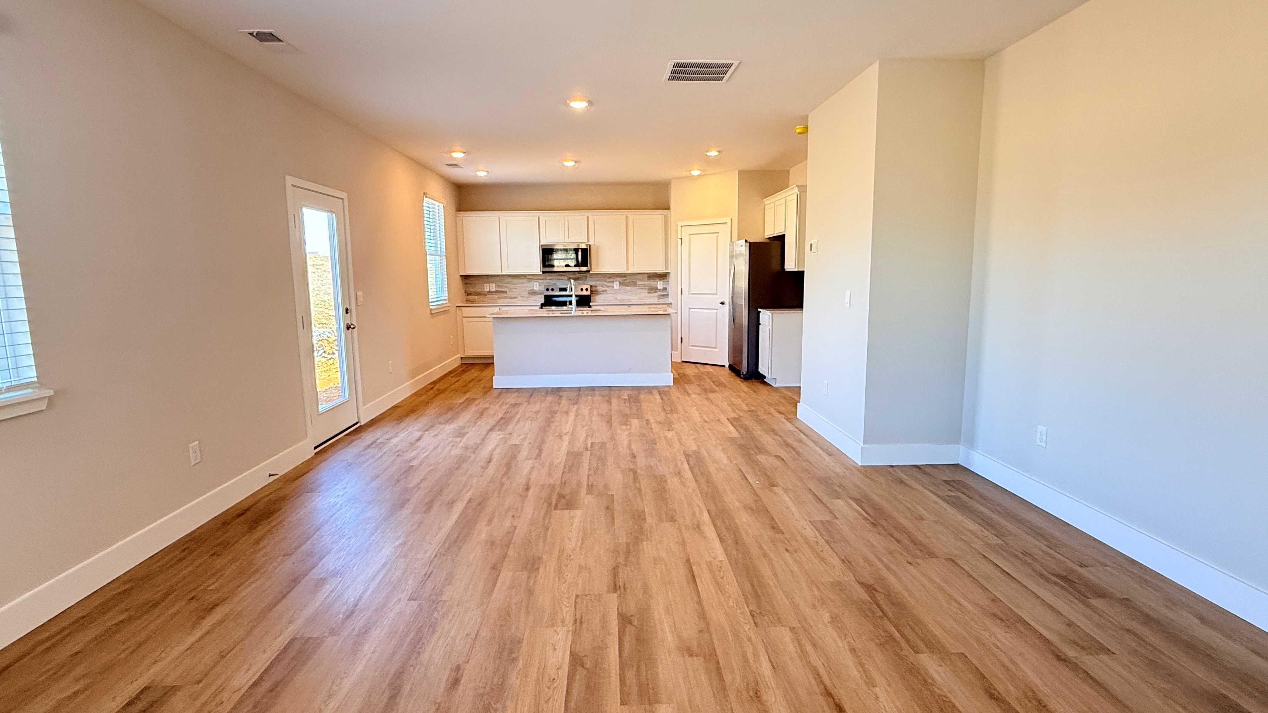 Kitchen, dining area, and living room.