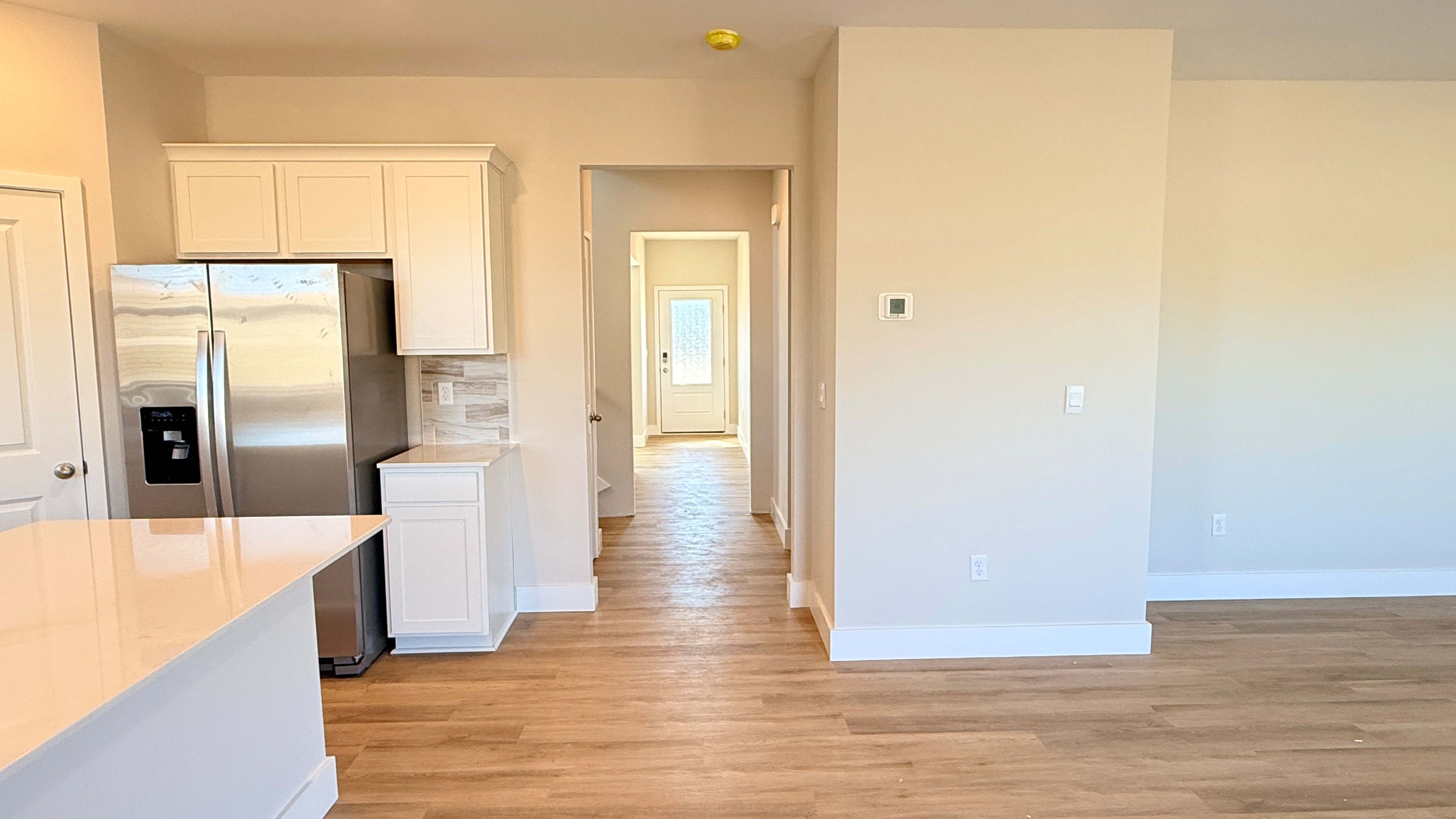 Kitchen, dining area, and foyer.