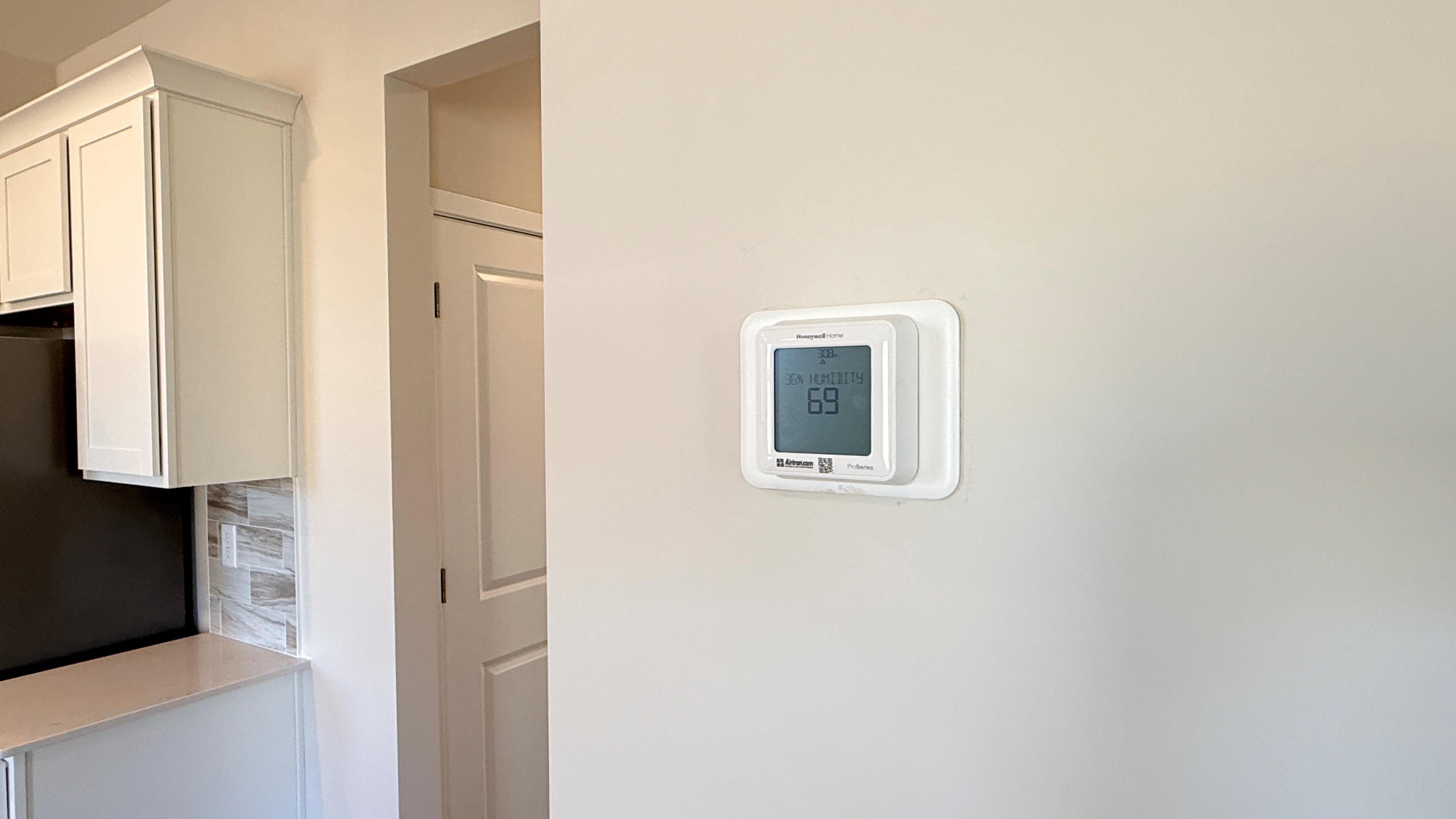 Digital thermostat on the wall.