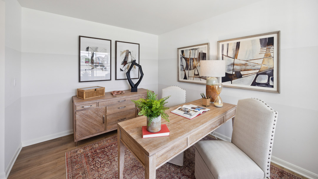 flex room with table accent chairs and credenza