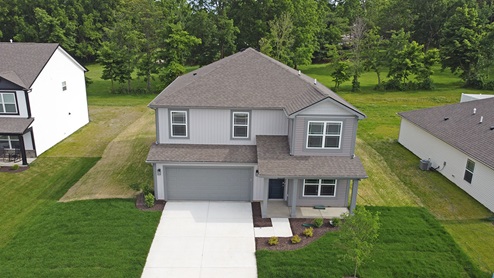 two story home on treelined lot