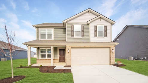 two story home with green gray siding and front porch