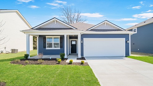 front view of ranch home with porch and blue siding