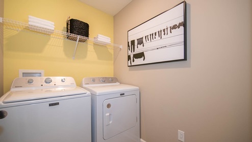 Laundry room located on upper floor of home