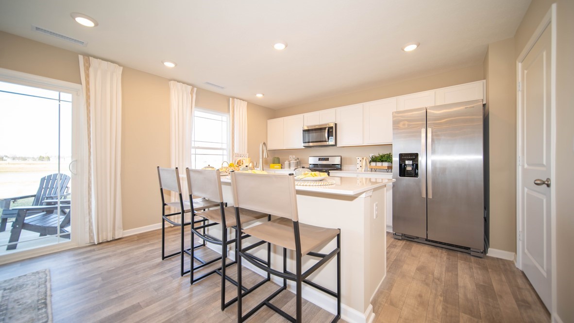 kitchen with whirlpool appliances, quartz countertops and smart home features