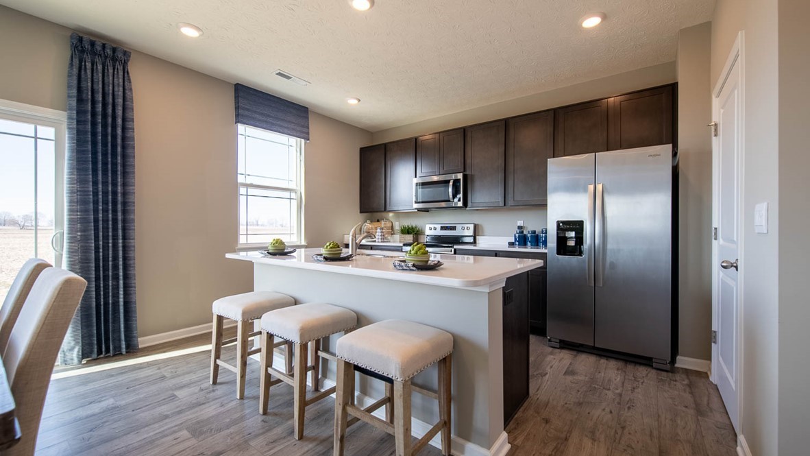 kitchen with bar seating and whirlpool appliances