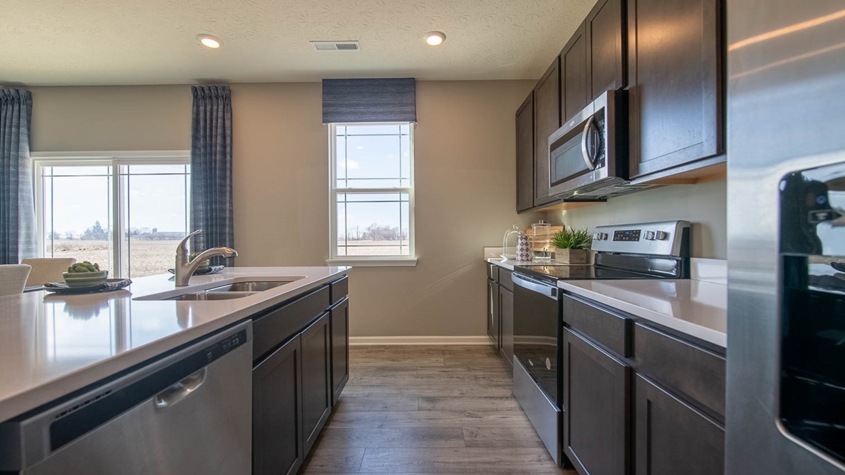 kitchen with bar seating and whirlpool appliances