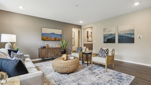 Open concept living space with natural light and simple furnishings.