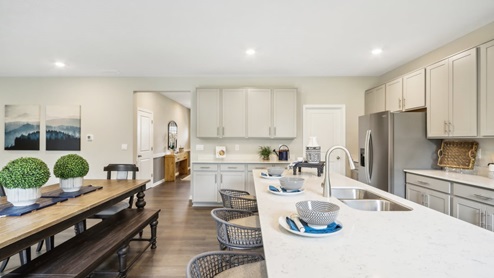 Open kichen connected to dining space with natural light.