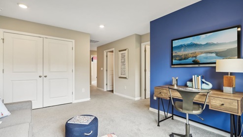 Bedroom with neutral walls, closet space, and natural lighting.