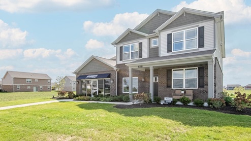 Exterior two-story home with stone detailing
