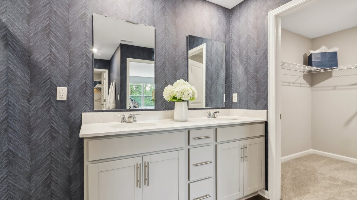 primary bathroom with dual vanity