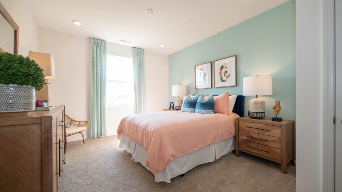 guest room with light aqua accent wall
