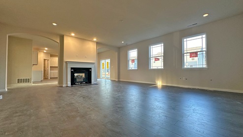 great room featuring double sided fireplace