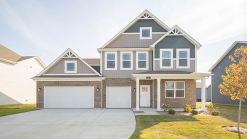 Exterior two-story home with stone detailing
