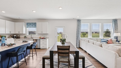 Interior kitchen with center island and white cabinets