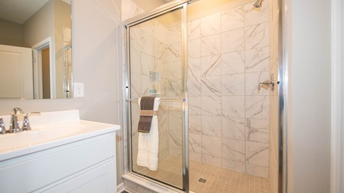 The primary bathroom includes a shower and private water closet