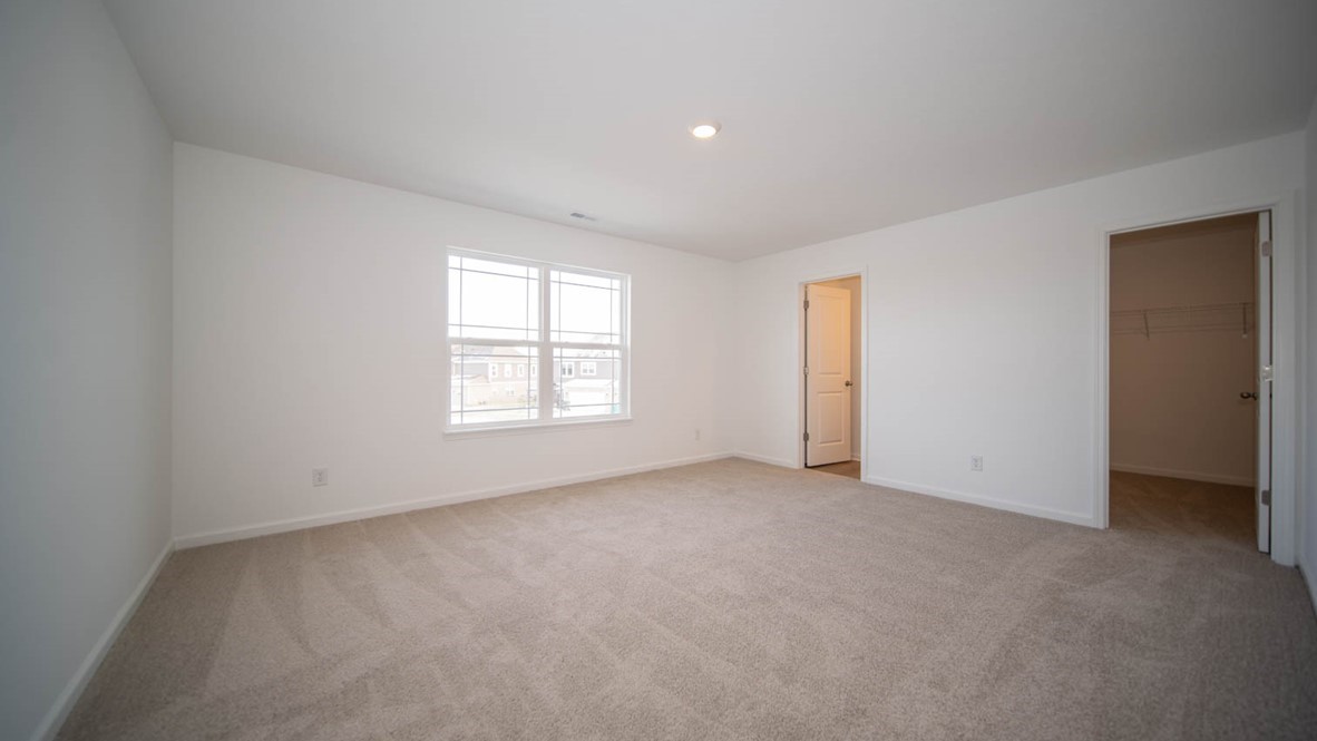 primary bedroom with large windows