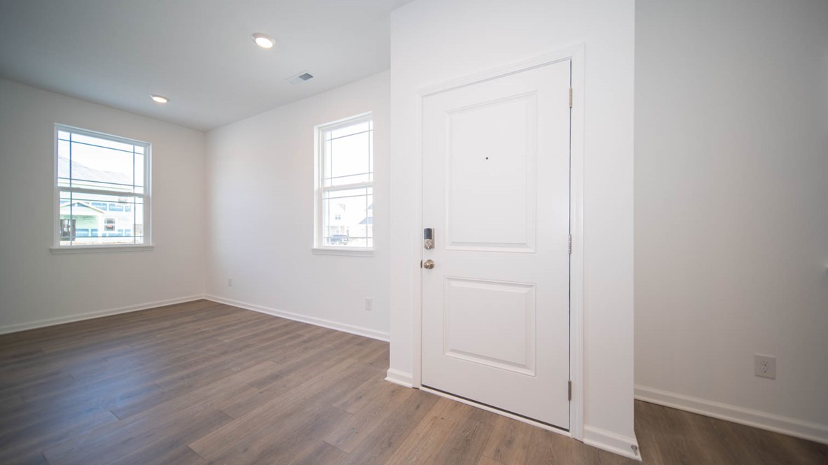 Entry door with wood laminate flooring.