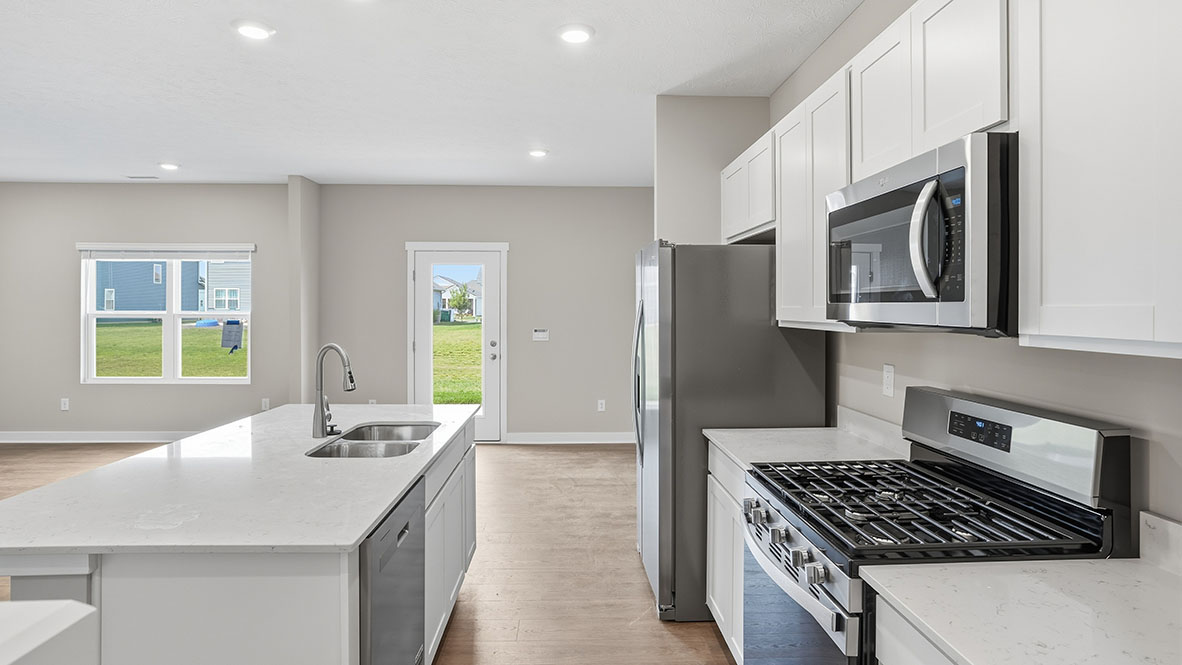 kitchen appliances and dining room view