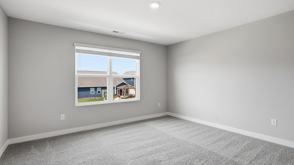primary bedroom with two windows