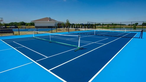 Outdoor tennis and pickleball court at the amenity center.