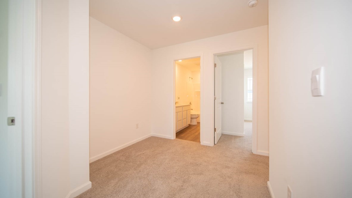 Second-floor hall area with carpet flooring.