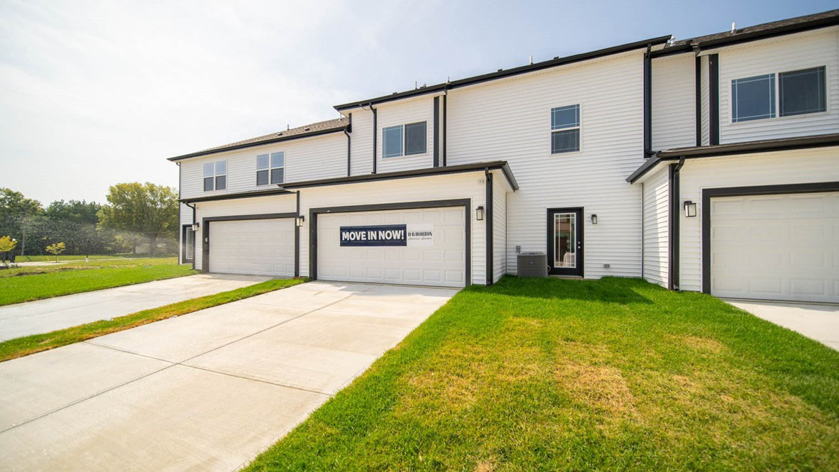 Rear exterior with a two-car garage.