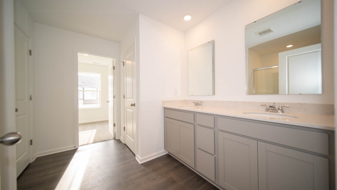 primary bathroom with dual vanity