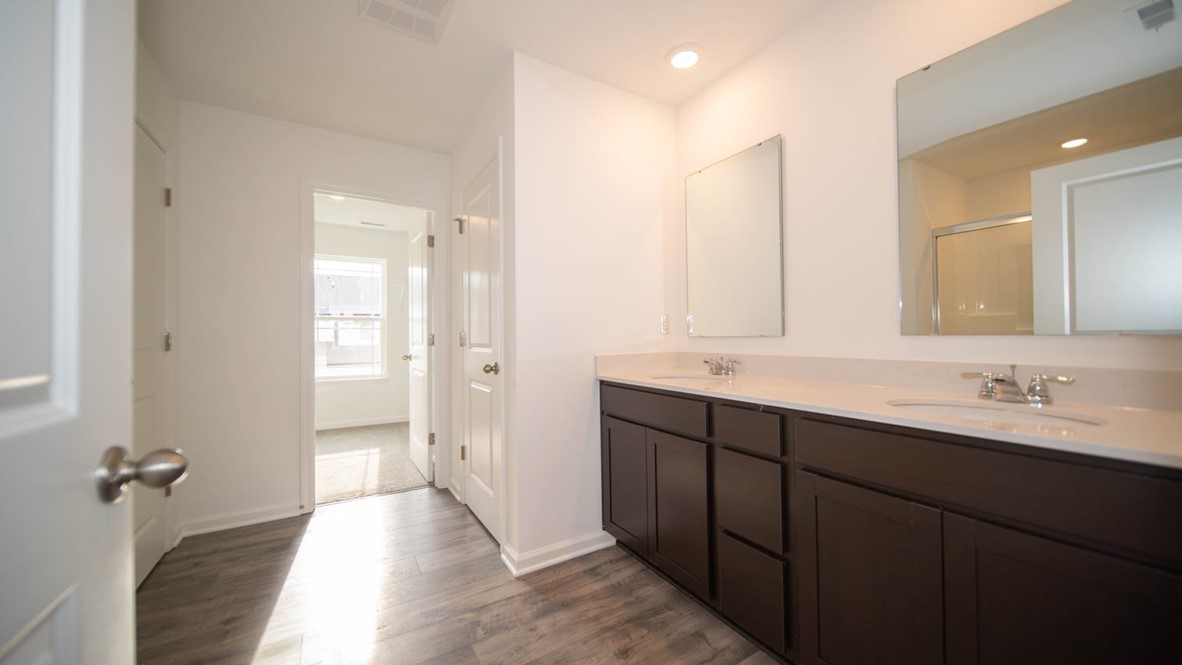 primary bathroom with dual vanity
