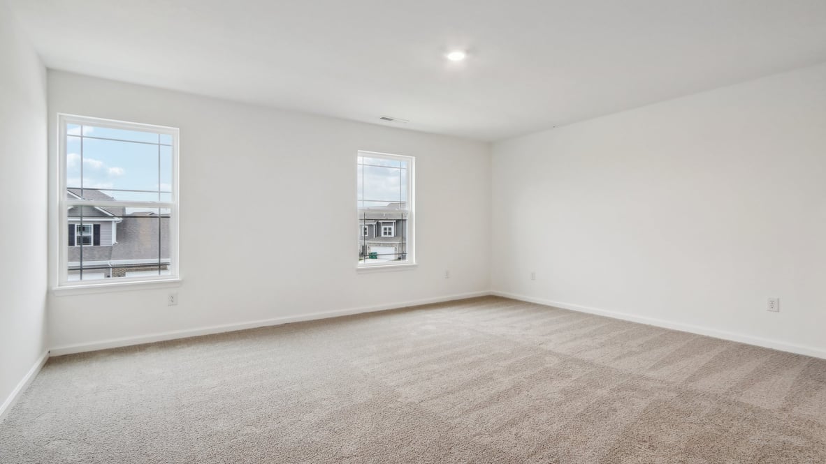 primary bedroom with large windows