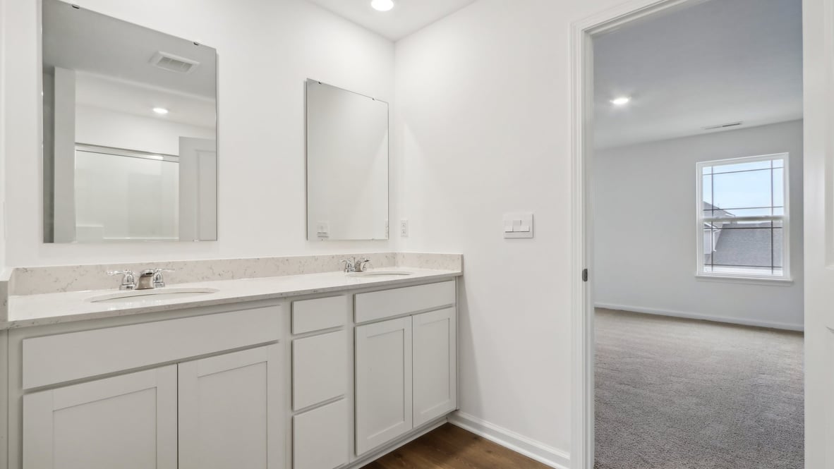 primary bathroom with dual vanity