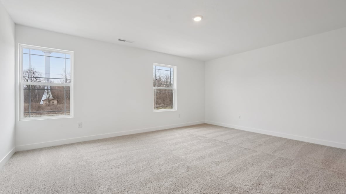 primary bedroom with large windows