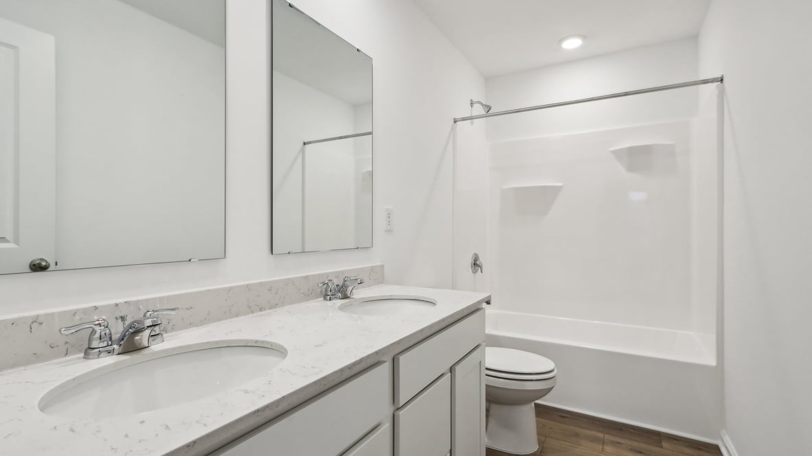 bathroom with dual vanity