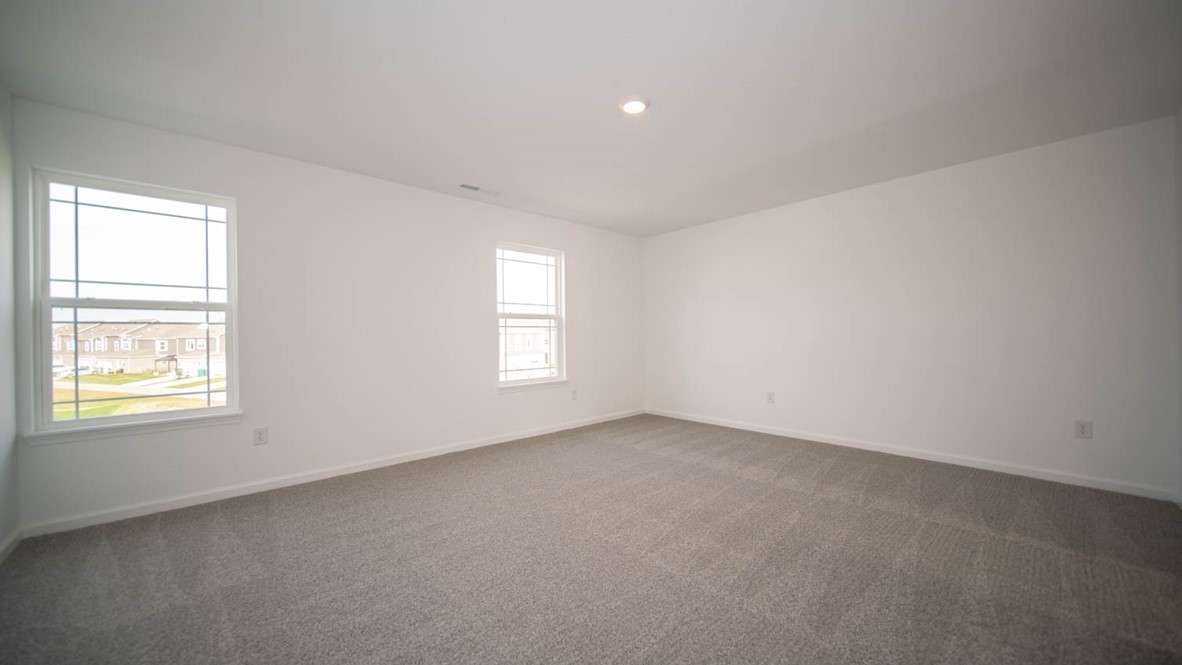 primary bedroom with large windows